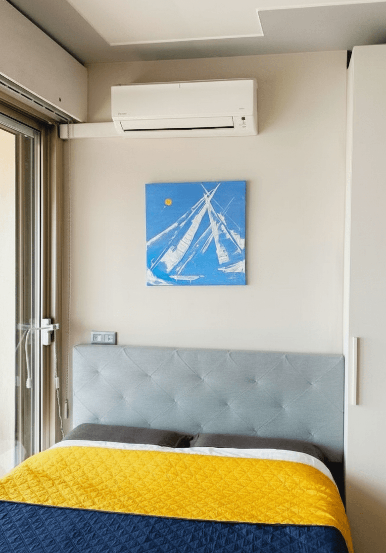 Compact bright studio with double bed and balcony access