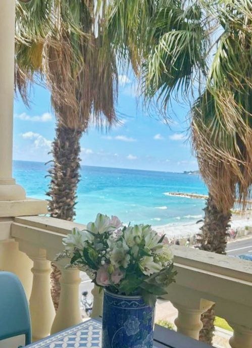 Mediterranean sea view with palm trees from the private balcony