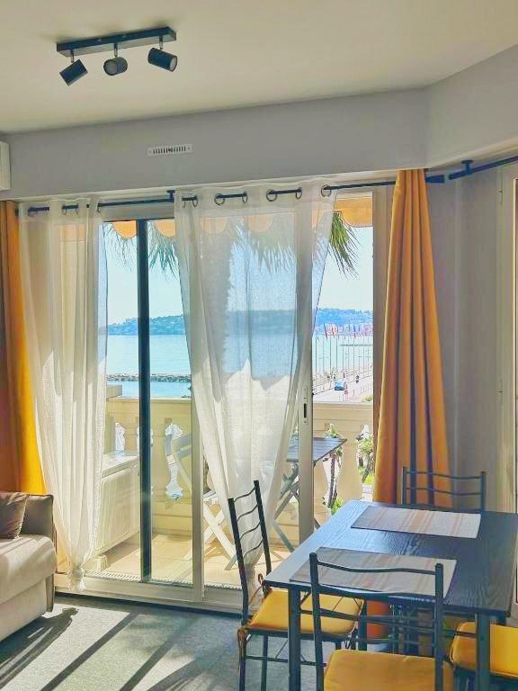Small dining table by the balcony in the sea view studio
